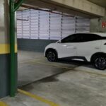 BYD Dolphin Mini estacionado em garagem fechada de prédio
